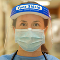 A nurse wearing a mask and protective face shield